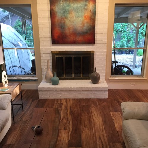 living room with hardwood floor Peoples Signature Flooring Austin Texas, 7.5 Inch Wide Hand Sculpted Acacia Natural 1x8 Baseboards