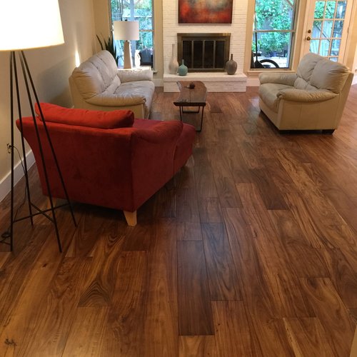 living room with hardwood floor Peoples Signature Flooring Austin Texas, 7.5 Inch Wide Hand Sculpted Acacia Natural 1x8 Baseboards