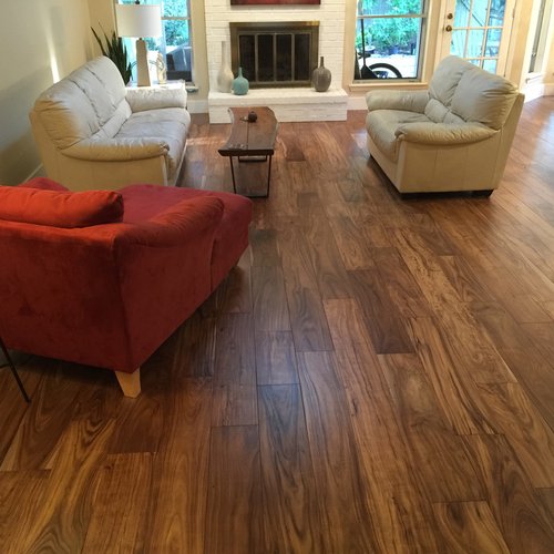 living room with hardwood floor Peoples Signature Flooring Austin Texas, 7.5 Inch Wide Hand Sculpted Acacia Natural 1x8 Baseboards