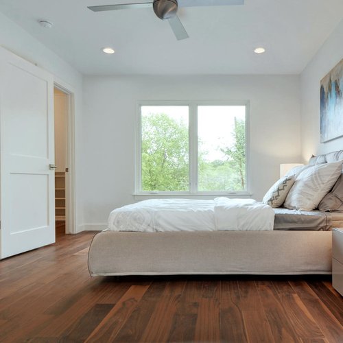 bedroom with hardwood floor Peoples Signature Flooring Austin Texas, Walnut Natural 5 Inch